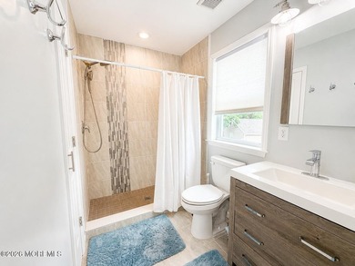 Completely reimagined, this exceptional raised ranch offers 3 - photo 14