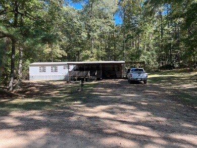 Discover peaceful lake living with this charming and - photo 3