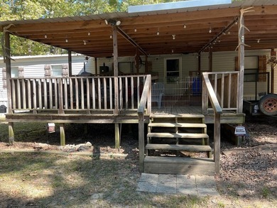 Discover peaceful lake living with this charming and - photo 4