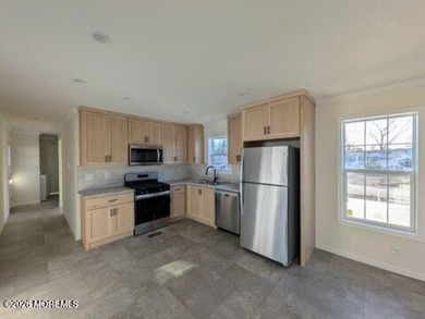This 2-BR 1-bath home delivers standout curb appeal w/classic - photo 2