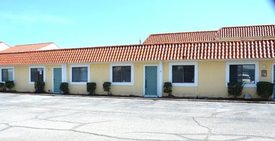 This unit boasts six separate offices plus a bathroom and a file - photo 2