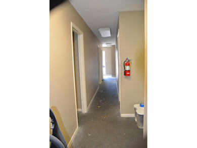 This unit boasts six separate offices plus a bathroom and a file - photo 5
