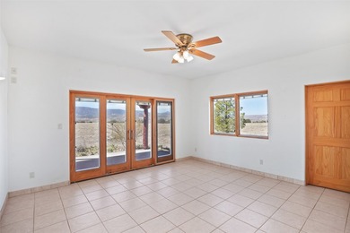 24 Hunter Drive is a pueblo style home in the Vista de Pedernal