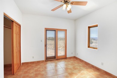 24 Hunter Drive is a pueblo style home in the Vista de Pedernal