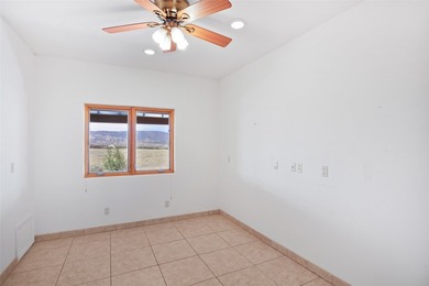 24 Hunter Drive is a pueblo style home in the Vista de Pedernal