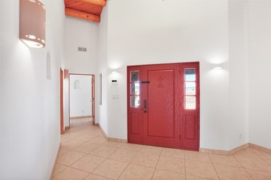 24 Hunter Drive is a pueblo style home in the Vista de Pedernal
