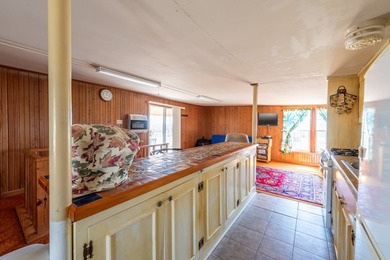 DISCOVER WATERFRONT LIVING IN THE DESIRABLE BUCKEYE KNOLL &