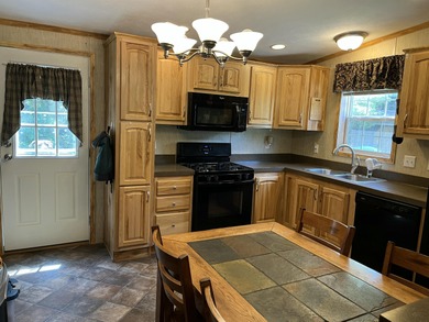 Nestled on a peaceful one-acre parcel in scenic Long Lake, this - photo 5