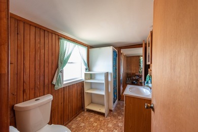 DISCOVER WATERFRONT LIVING IN THE DESIRABLE BUCKEYE KNOLL &