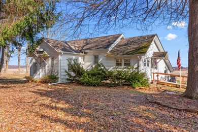 A homestead with 6 acres, several buildings that are set up for