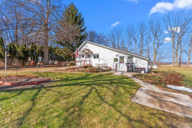 A homestead with 6 acres, several buildings that are set up for