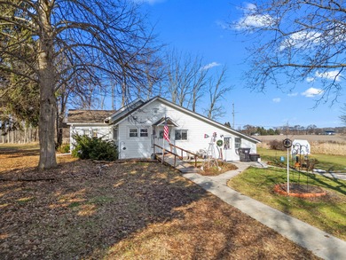 A homestead with 6 acres, several buildings that are set up for