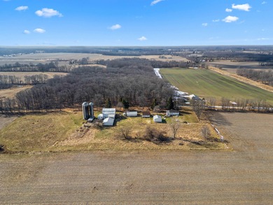 A homestead with 6 acres, several buildings that are set up for