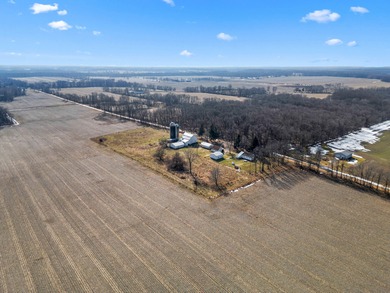 A homestead with 6 acres, several buildings that are set up for