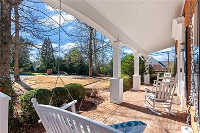 This beautiful brick traditional, majestically set back on the