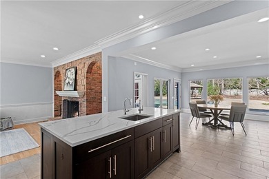 This beautiful brick traditional, majestically set back on the