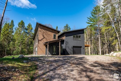 Tucked away in a beautiful private wooded setting, this - photo 3