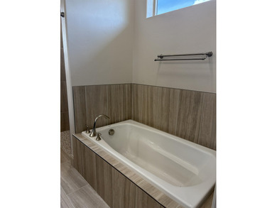 *Ruby Model* with no steps access is situated across from the