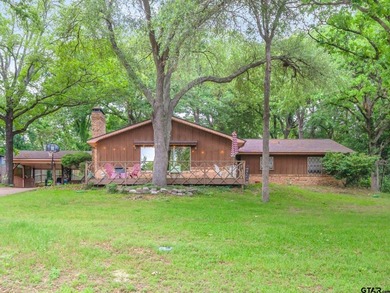 Tucked inside the gated golf and lake community of Hideaway and - photo 1