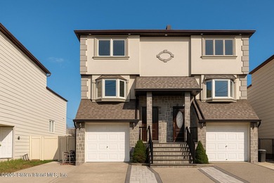 'This elegant 2 Family home features a sophisticated stocco and - photo 1