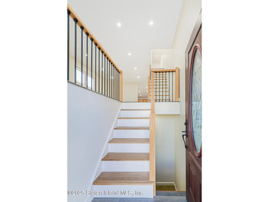 'This elegant 2 Family home features a sophisticated stocco and - photo 8