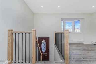 'This elegant 2 Family home features a sophisticated stocco and - photo 9
