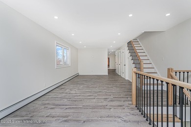 'This elegant 2 Family home features a sophisticated stocco and - photo 10