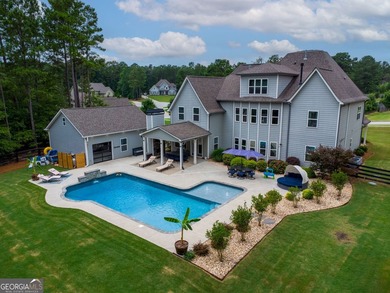 Welcome to 122 Brooks Landing, an exceptional 5-bedroom, 5 - photo 4