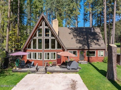 Just steps from the shores of Lake Tahoe, this rustic A-frame - photo 1