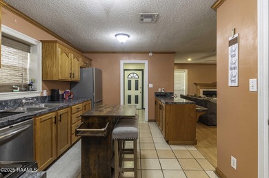 Acadian Style solid metal frame home with metal roof situated on