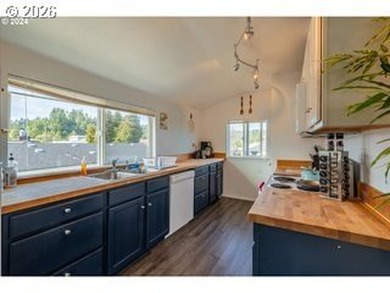 Coastal charm meets fun, lofty vibes in this multi-family home - photo 4