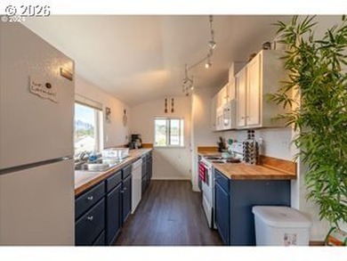 Coastal charm meets fun, lofty vibes in this multi-family home - photo 5