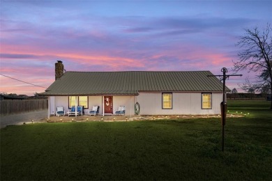 Enjoy the beautiful sunrise as you look out across the quiet - Lake Home For Sale in Thornton, Texas