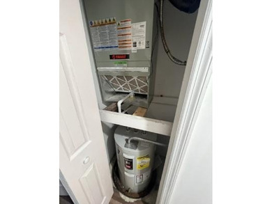 Updated top floor condo with brand newer AC, water heater, new - photo 6