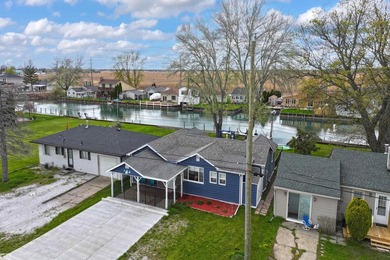 Welcome to this beautifully renovated canal-front home just off - photo 3