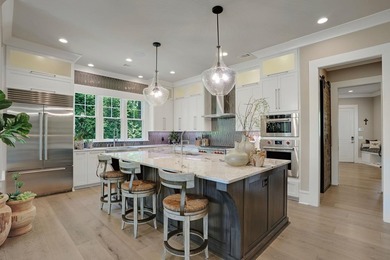 LIKE NEW CUSTOM HOME POSITIONED ALONG THE 11TH HOLE OF THE CREEK - photo 16