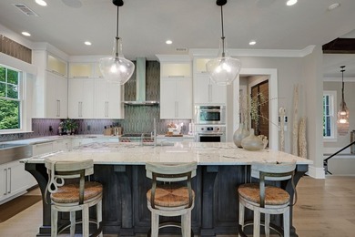 LIKE NEW CUSTOM HOME POSITIONED ALONG THE 11TH HOLE OF THE CREEK - photo 17