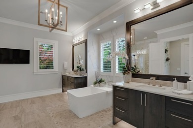 LIKE NEW CUSTOM HOME POSITIONED ALONG THE 11TH HOLE OF THE CREEK - photo 25