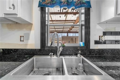 Looking for privacy, land, and value? This unique 4-bedroom, 2