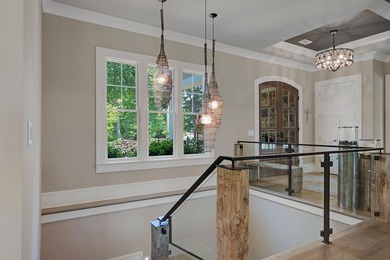 LIKE NEW CUSTOM HOME POSITIONED ALONG THE 11TH HOLE OF THE CREEK - photo 32