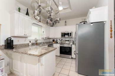 Enjoy peaceful golf course living in this well-maintained - photo 10