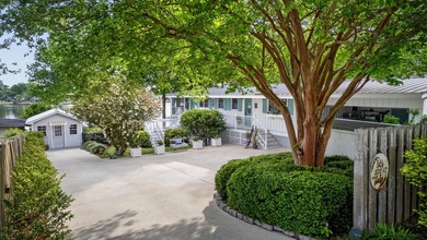 Welcome to 1204 Joyner Drive, a distinctive lakefront residence - photo 11