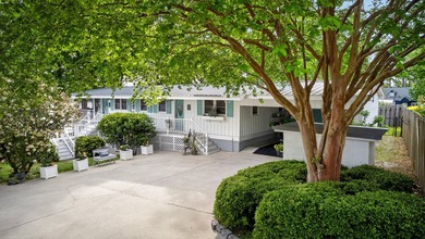 Welcome to 1204 Joyner Drive, a distinctive lakefront residence - photo 12