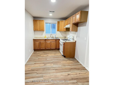 WHY RENT WHEN YOU CAN OWN? AFFORDABLE TOWNHOUSE IN MIDLAND BEACH - photo 4