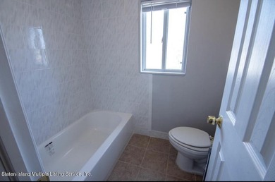 WHY RENT WHEN YOU CAN OWN? AFFORDABLE TOWNHOUSE IN MIDLAND BEACH - photo 8