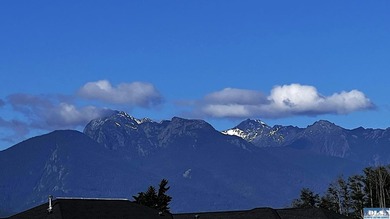 This prime 1 acre building lot with Olympic Mountain views and - photo 11