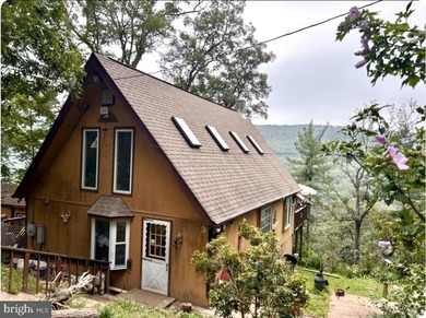 This rustic mountain cabin offers the perfect blend of privacy - photo 1