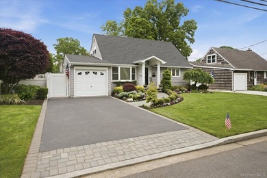 Welcome to this MINT Cape Cod-style home nestled in the heart of - photo 1