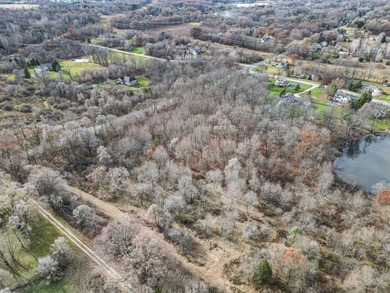 (private lake, pond, creek) Acreage Sale Pending in Alto Michigan