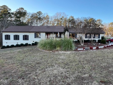 Spacious lake home on 2.9 acre lot with boat dock in place. - Lake Home For Sale in Manson, North Carolina